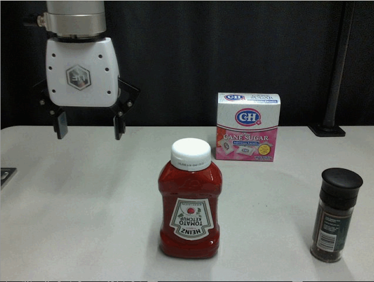 Robotics and AI research laboratory with robotic arms and computer systems